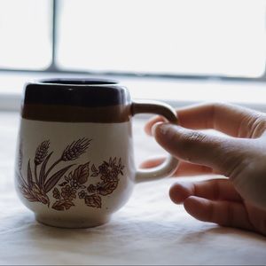 Small ceramic mug with flower details